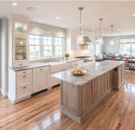 Adding LED lighting inside your glass cabinet doors will brighten up a kitchen. Kitchen designed by Apex Kitchens & Baths